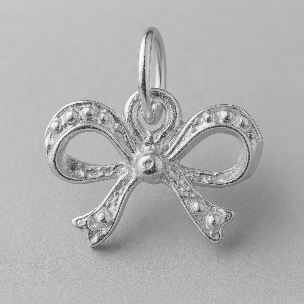950 Platinum - Sculpted Ribbon Bow Charm