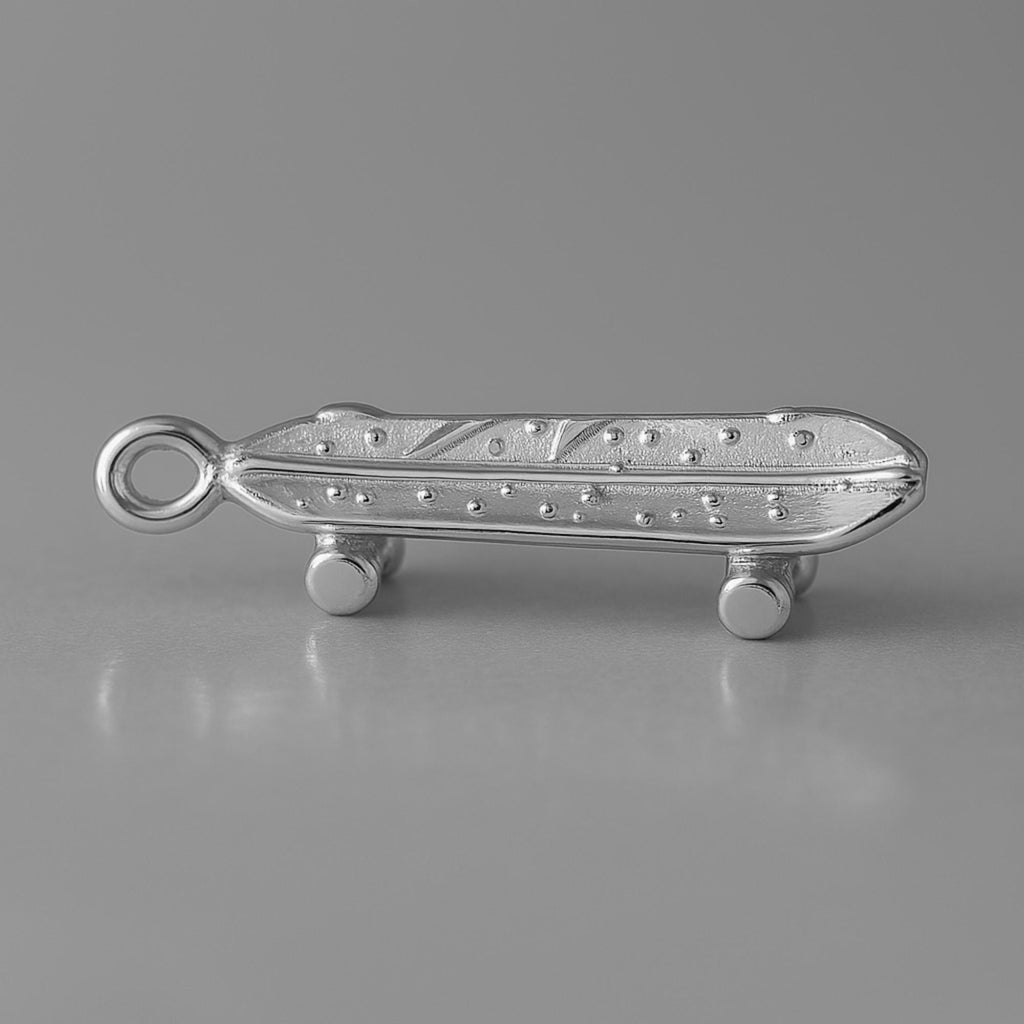 950 Platinum - Battered Skateboard Charm